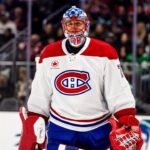 Jakub Dobes, gardien du Canadien, en chandail blanc, devant son filet