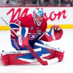 Jakub Dobes, gardien des Canadiens de Montréal, en position d'arrêt devant son filet