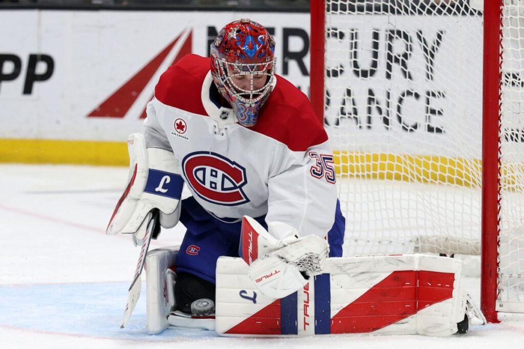 Samuel Montembeault, numéro 35 du Canadien, devant son filet en chandail blanc